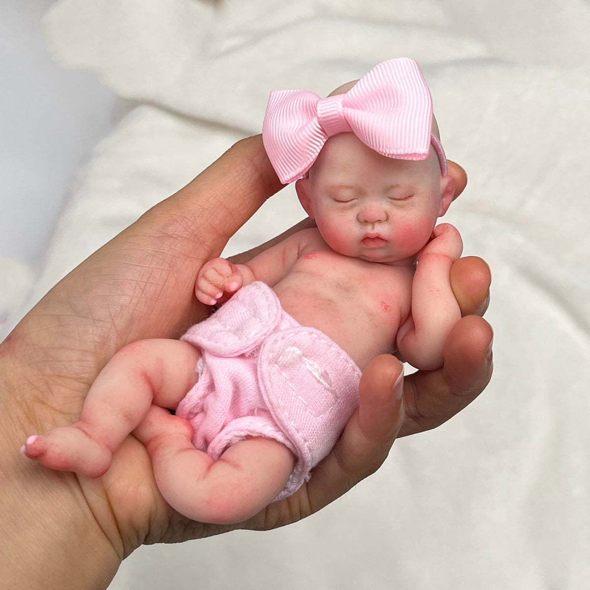 Mire and Mire doll with pacifier and bottle accessories for imaginative care play.