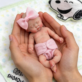 Mire and Mire reborn 5.5-inch girl doll with lifelike skin for tactile holding.