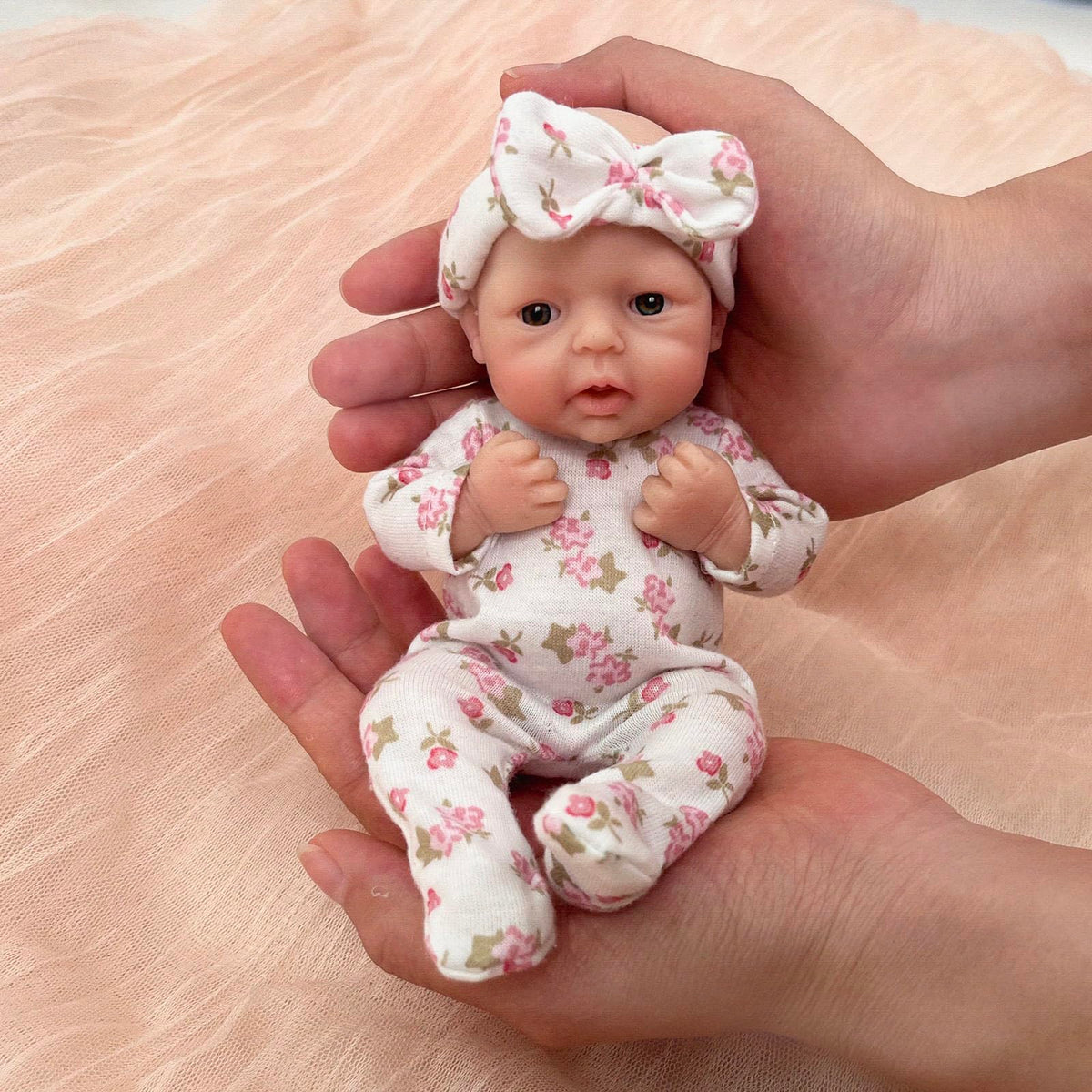 Mire & Mire Reborn 7inch full-body silicone doll highlighting soft, skin-like texture