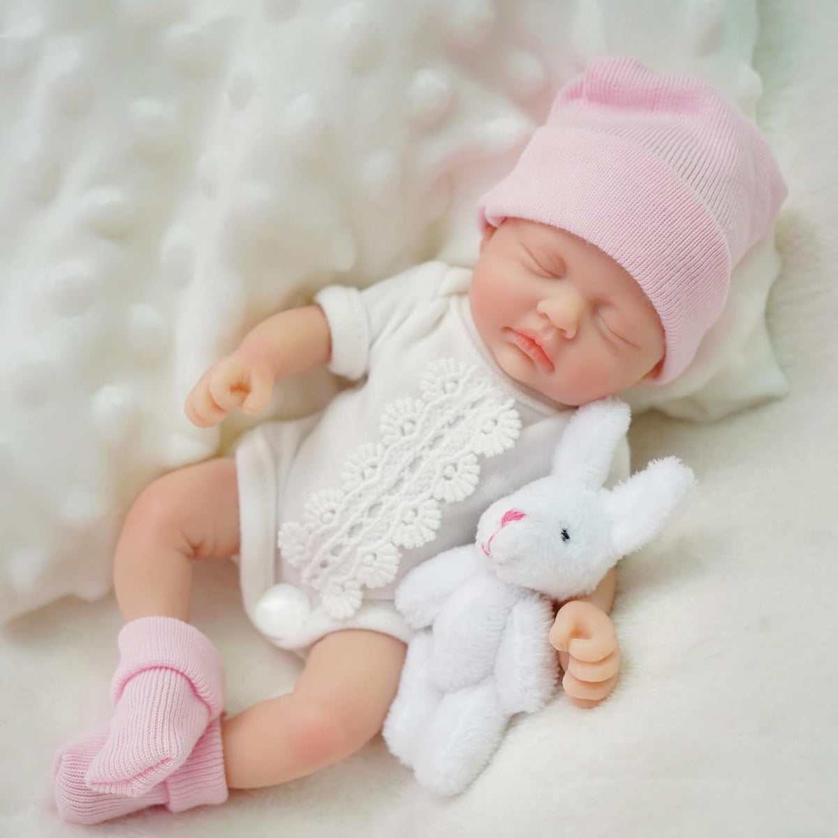 Mire & Mire Reborn baby quilt image emphasizing cozy comfort during snuggle time