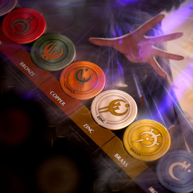 Mistborn Deckbuilding Game box art captures cinematic fantasy adventure.