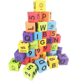Child stacking MOBU blocks during learning playtime.