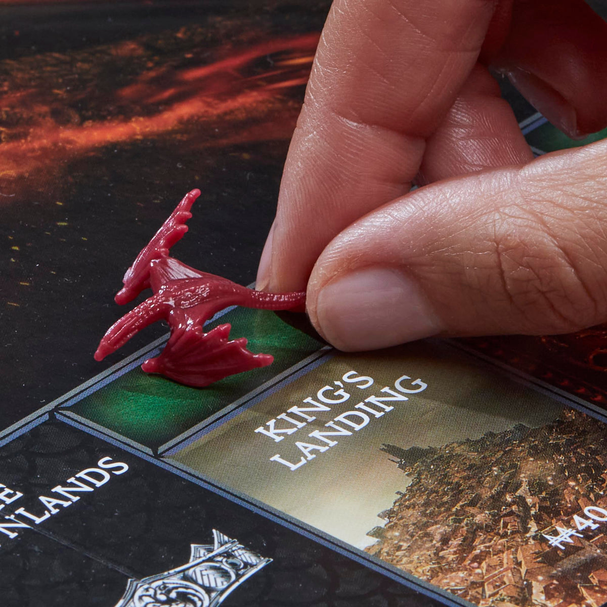 Monopoly House of the Dragon edition dragon eggs and dragons reinforce territory visually.
