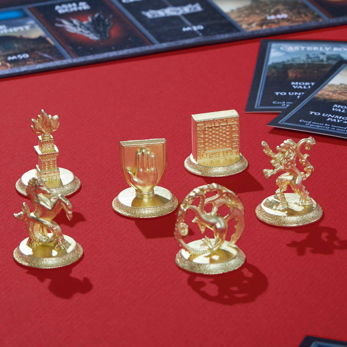 Themed coins bring tactile currency to the game.