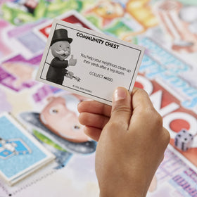 Monopoly Sparkle Edition Mr. Monopoly figure gleams on the board.