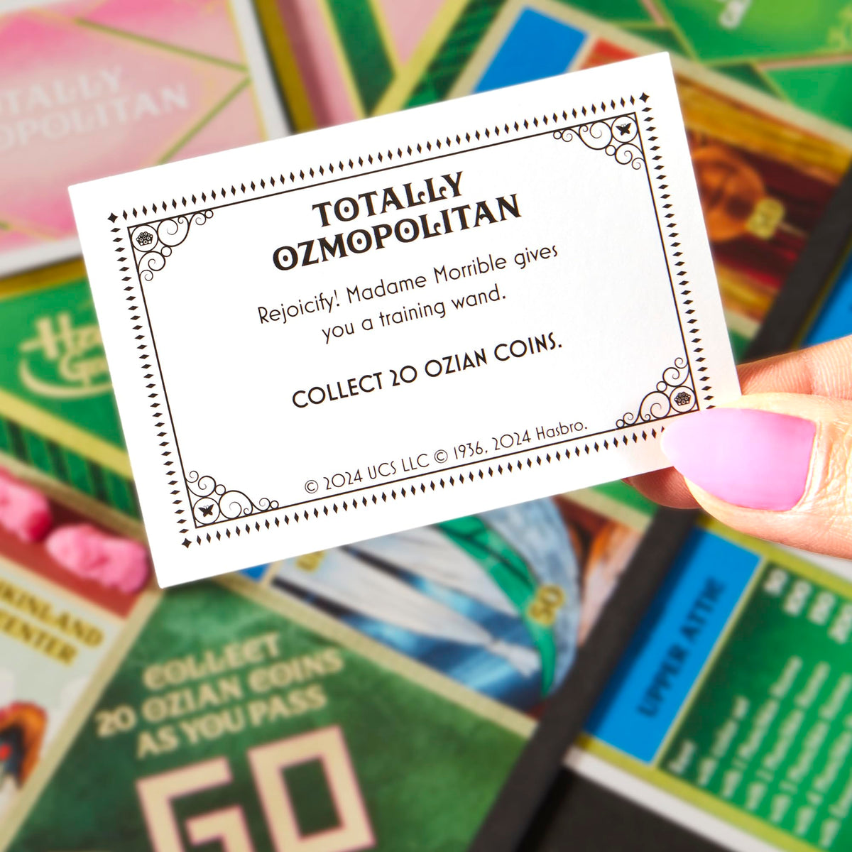 Monopoly Wicked Edition Ozian cards bring film moments to life.