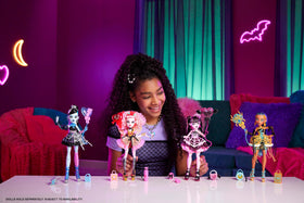 Monster High Draculaura pink satiny dress with spiderweb skirt detail.
