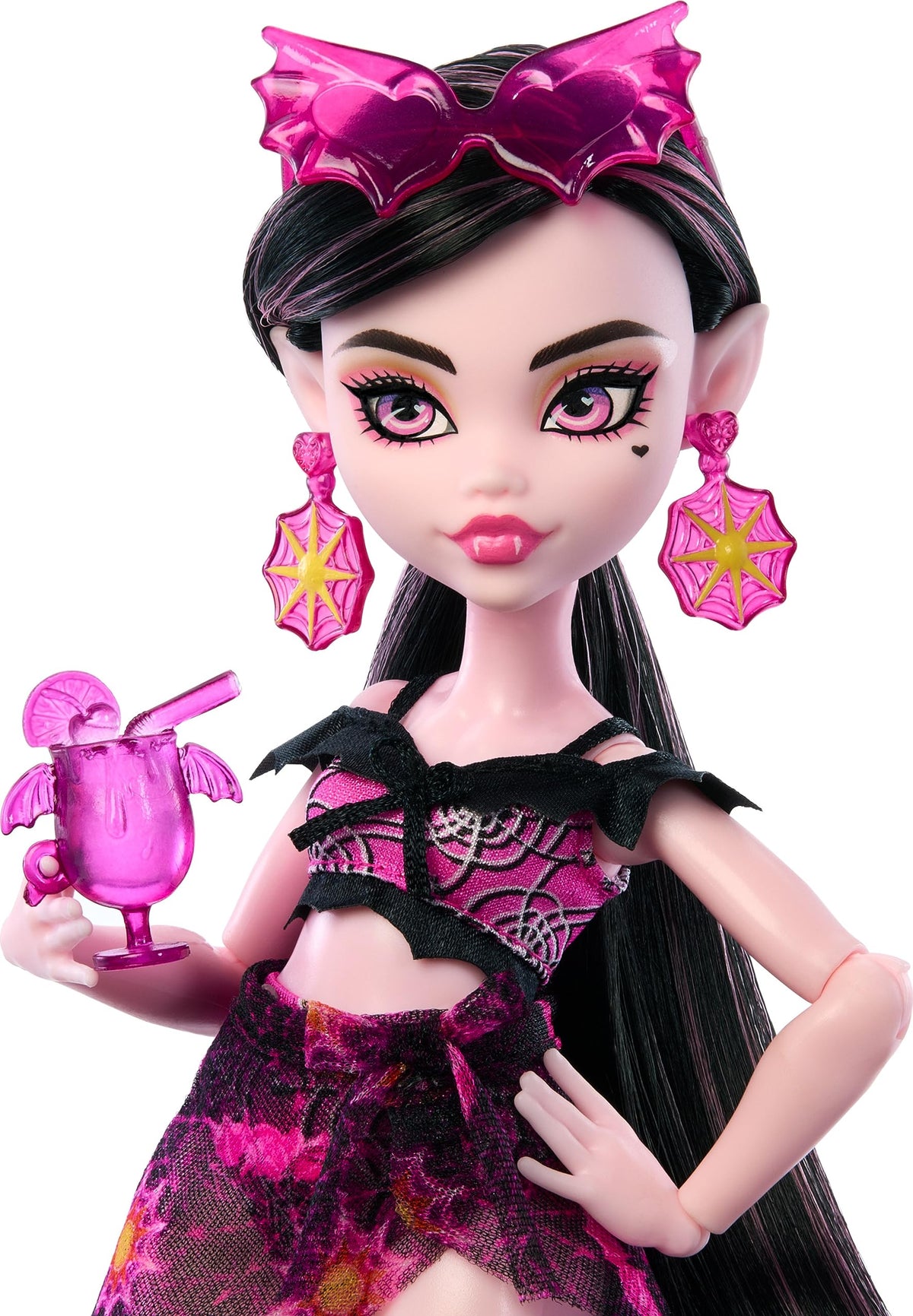 Monster High Draculaura with wide-brim hat shields sun during seaside fun.