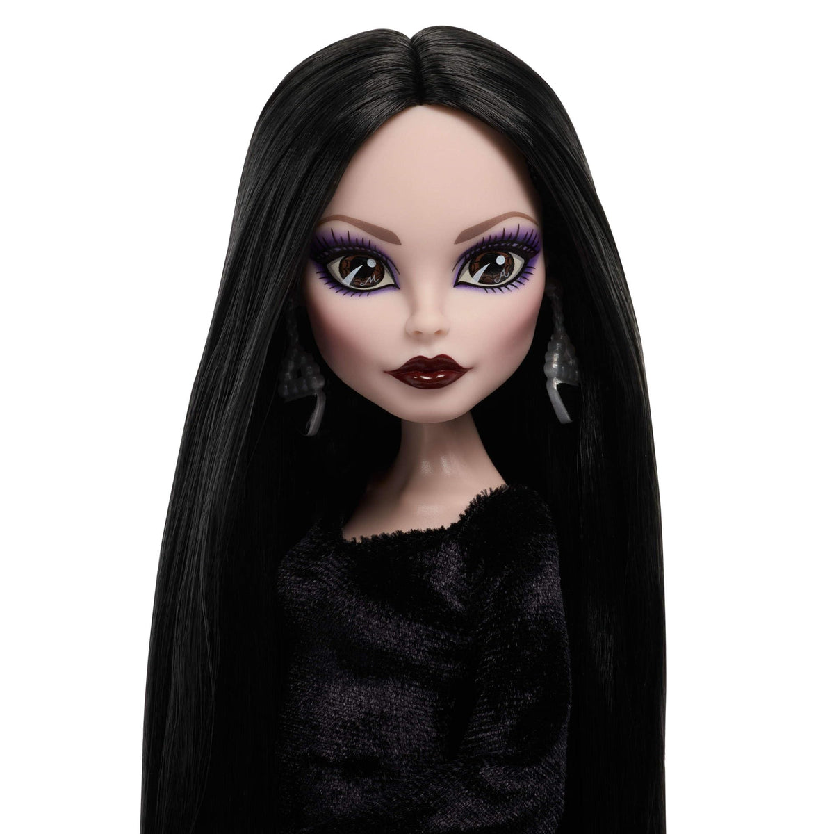 Silvery earrings with black stones on Morticia for elegant display