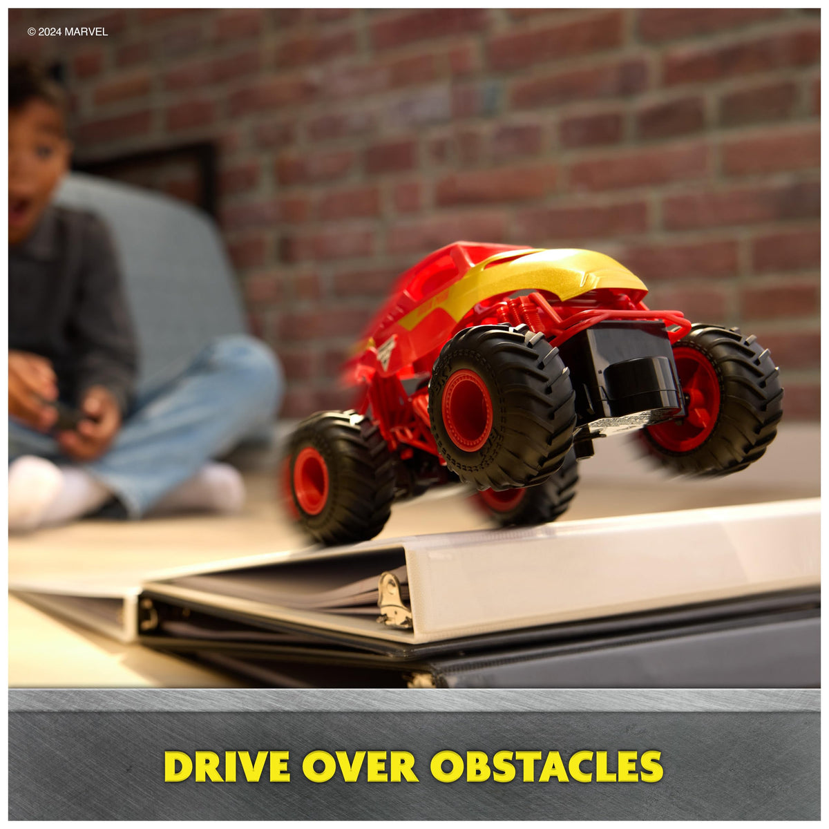 Oversized tires of the Iron Man RC truck ready for playtime adventures