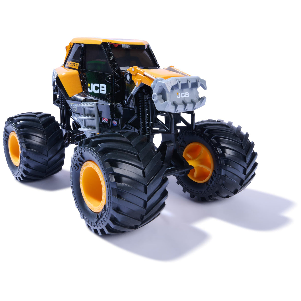 Monster Jam JCB DIGATRON tire detail shows rubber tires for traction.