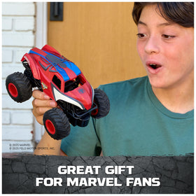 Action moment of Monster Jam Spider-Man RC truck racing indoors