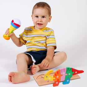 Eco-friendly water-based finish on Montessori Mama wooden dinosaur puzzles.