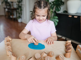 Montessori & Me encourages creativity and storytelling with expressive clay stamping sessions.
