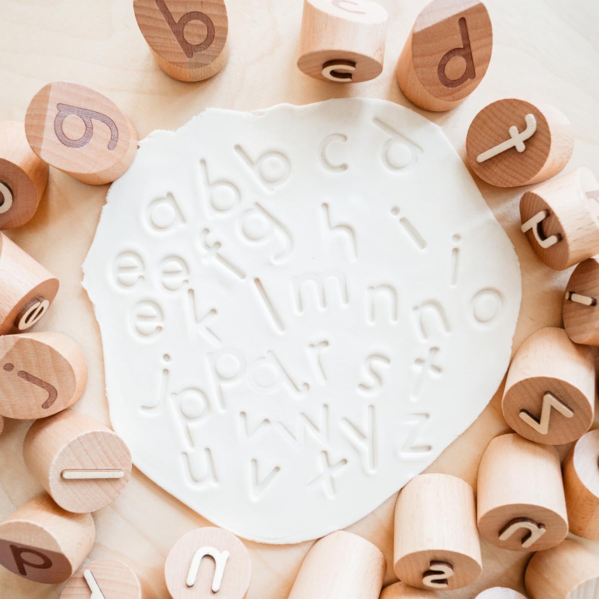 Montessori & Me wooden letter stamps, 1.5-inch, for easy grip and precise impressions.