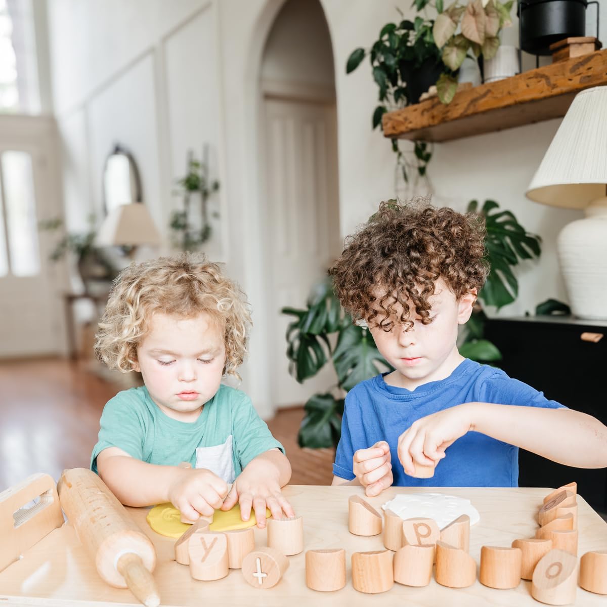 Montessori & Me help refine motor skills through twisting, turning, and pressing clay.