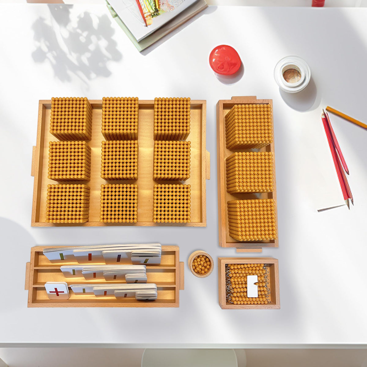Montex Montessori Golden Beads storage trays keep materials tidy.
