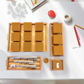 Montex Montessori Golden Beads storage trays keep materials tidy.