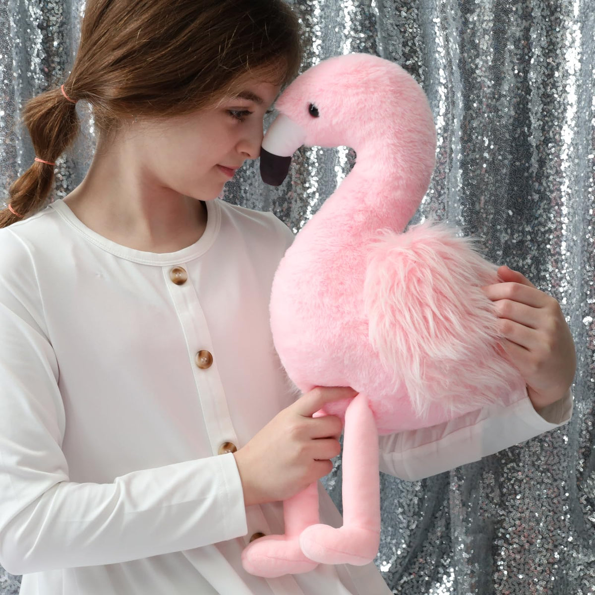 MorisMos flamingo with four baby toys inside inspires imaginative pretend play.