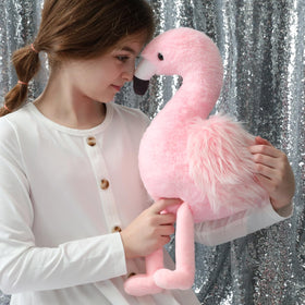 MorisMos flamingo with four baby toys inside inspires imaginative pretend play.