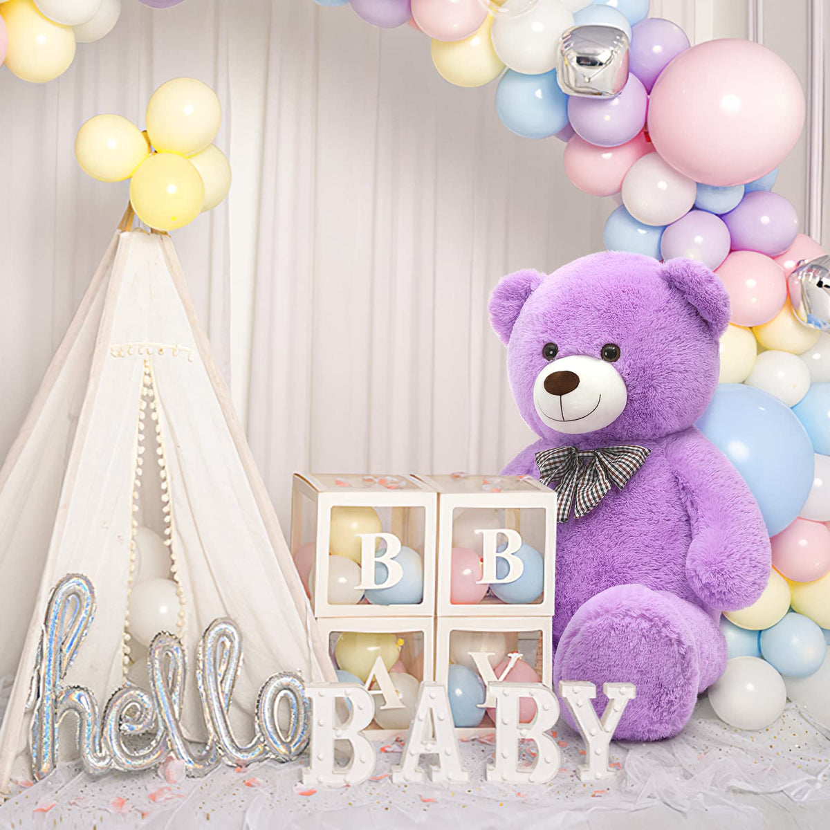 MorisMos violet bear beside sofa, ideal for long-distance hugs on video calls