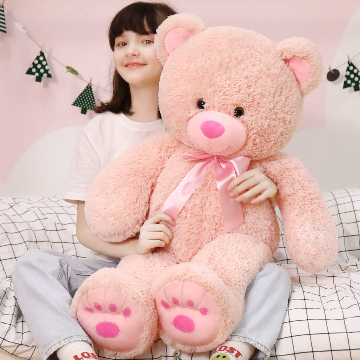 MorisMos 36in pink teddy bear in a cuddling pose, ideal for bedtime hugs.