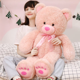 MorisMos 36in pink teddy bear in a cuddling pose, ideal for bedtime hugs.