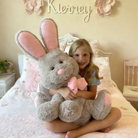 MorisMos grey bunny with pink ears offers gentle nap-time comfort.
