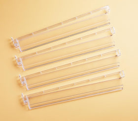 Mose Cafolo clear Mahjong rack pushers set of four arranged for a neat wall display