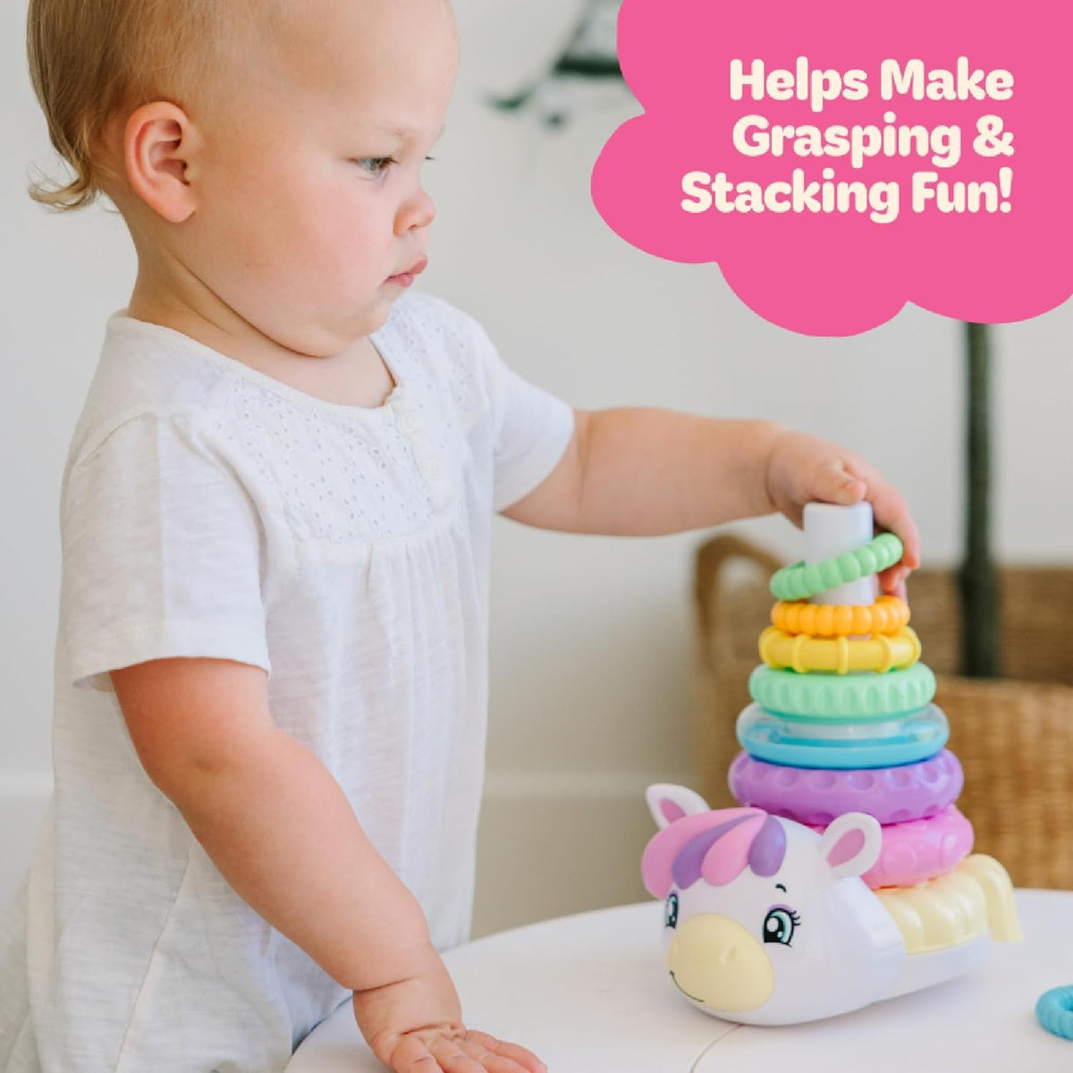 Move2Play rattle ring adds sensory feedback during stacking play.