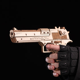 MU Desert Eagle puzzle includes rubber bands and tiny target for practice