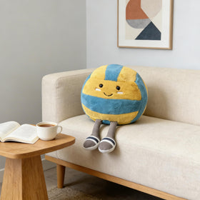 MUALML volleyball pillow with legs extended highlights size and playful design.