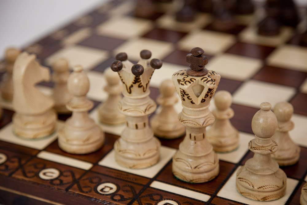 Muba carved hornbeam and sycamore chess pieces, weighted with felt bottoms for stable moves