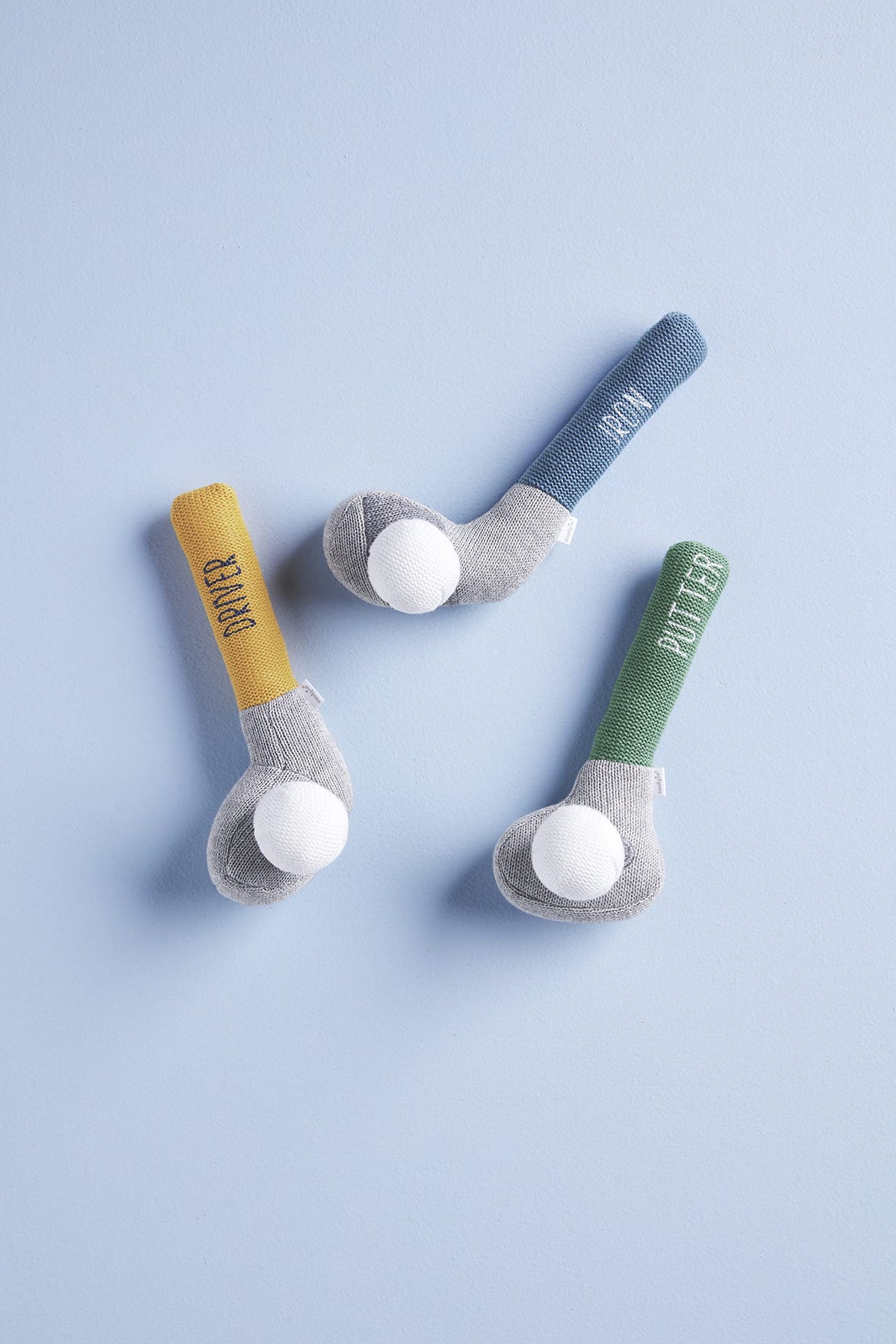 Mud Pie Goft Knit Rattle Green Putter Club, attached golf ball creates engaging rattle sounds.