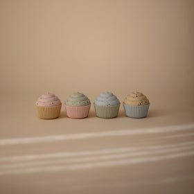 Mushie cupcake toy with stackable pieces promotes fine motor skills and color recognition