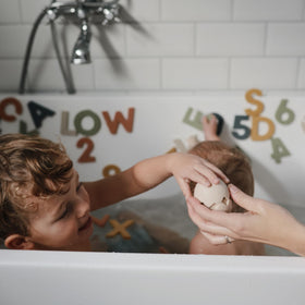 Mushie Dino bath toy mold-free and BPA-free for safe play.