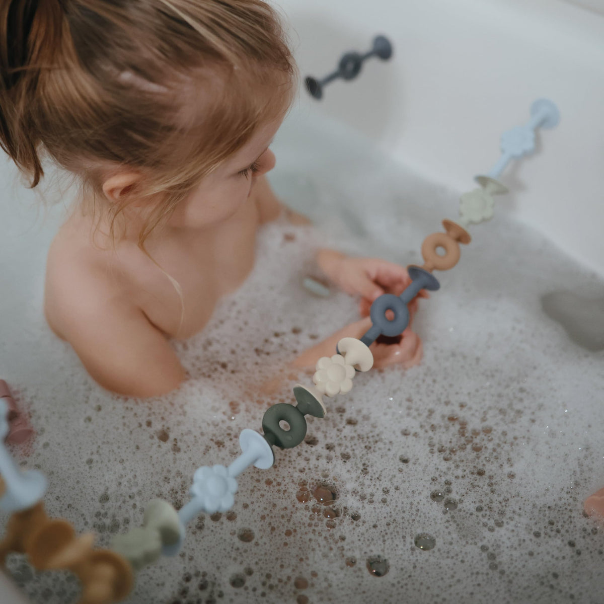 Mushie donut soft, non-toxic silicone pieces safe for little hands