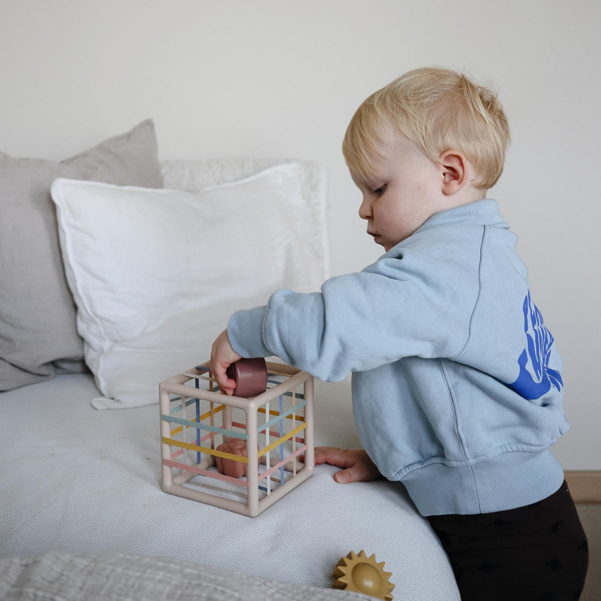 Mushie Elastic Shape Sorter nature-inspired shapes support problem solving