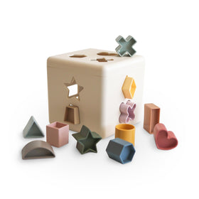 Mushie Shape Sorting Box cover shows a durable, kid-safe design for early play.