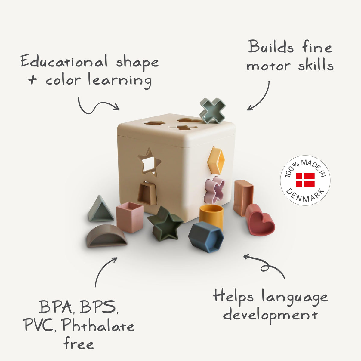 Mushie Shape Sorting Box toddler play scene illustrating sorting shapes in engaged exploration.