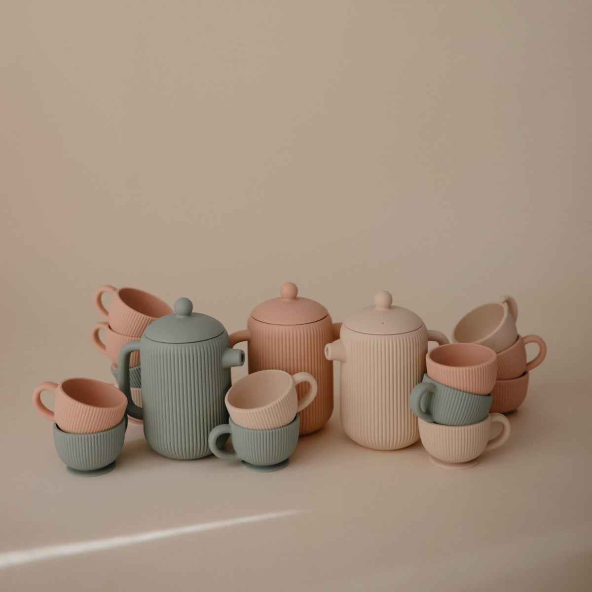 Mushie teapot lid removed image for engaging pouring play