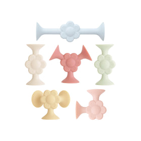 Mushie silicone suction builder 18-piece set fosters imaginative play and fine motor skills.