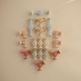 Close-up of soft, non-toxic Mushie silicone pieces for safe bath and play.