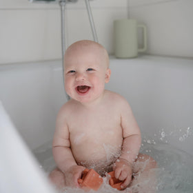 Mushie Vehicles bath toy excavator opens into two parts for rinsing
