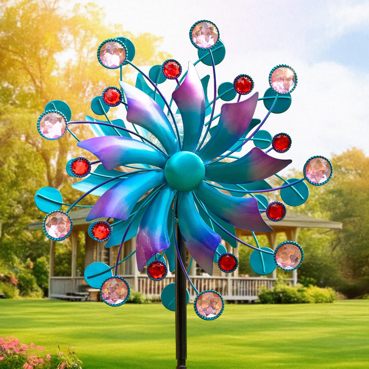 MXwcy Solar Wind Spinner with Lights globe glows softly at night for garden ambiance.