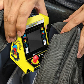 My Arcade Pac-Man Nano Player side view shows handheld comfort for travel.