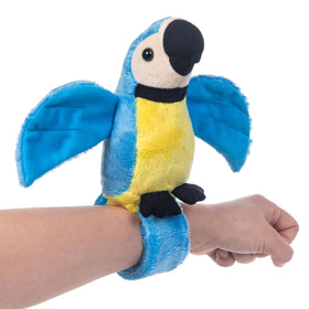 My OLi talking parrot with wristband on wrist, repeats your words for playful interaction.