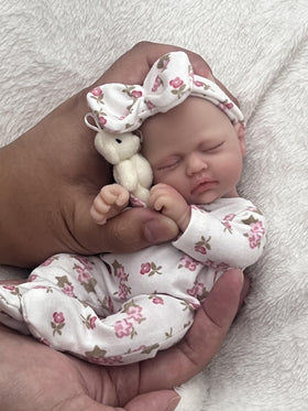 MYREBABY Betty 7-inch doll face detail for lifelike play and tactile joy.