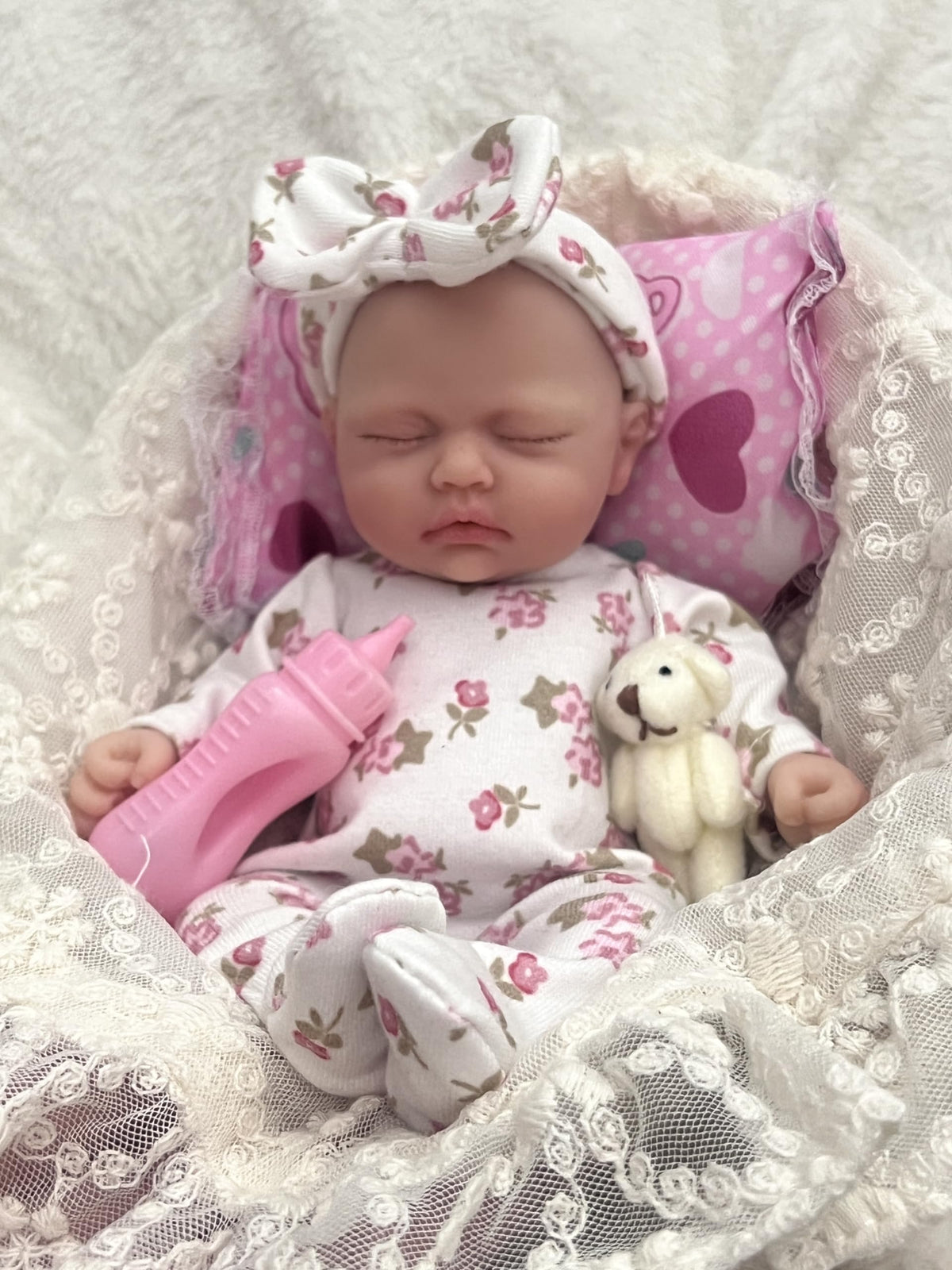 MYREBABY mini doll with bottle and pacifier supports interactive feeding role play.