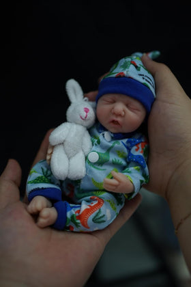 MYREBABY Eric full-body silicone doll wearing included clothing set.